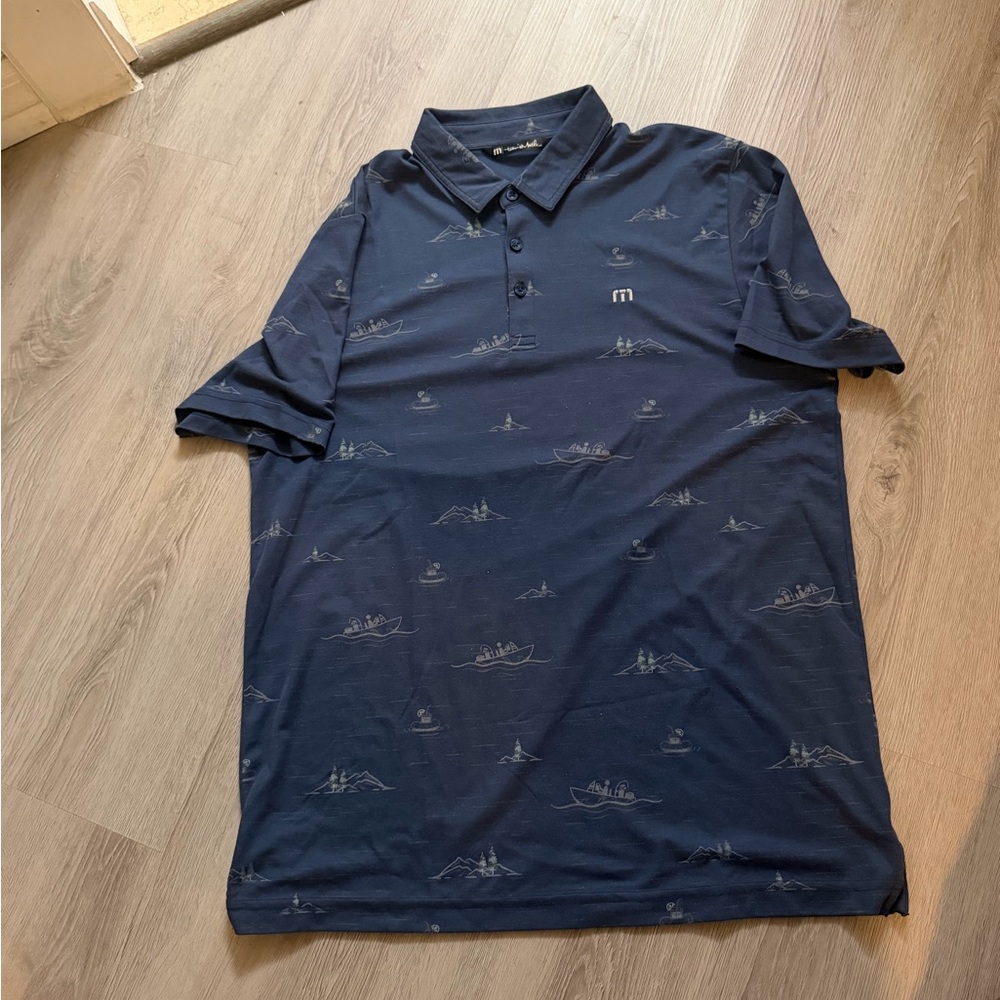 Travis Mathew Navy Polo with Subtle Nautical Motif